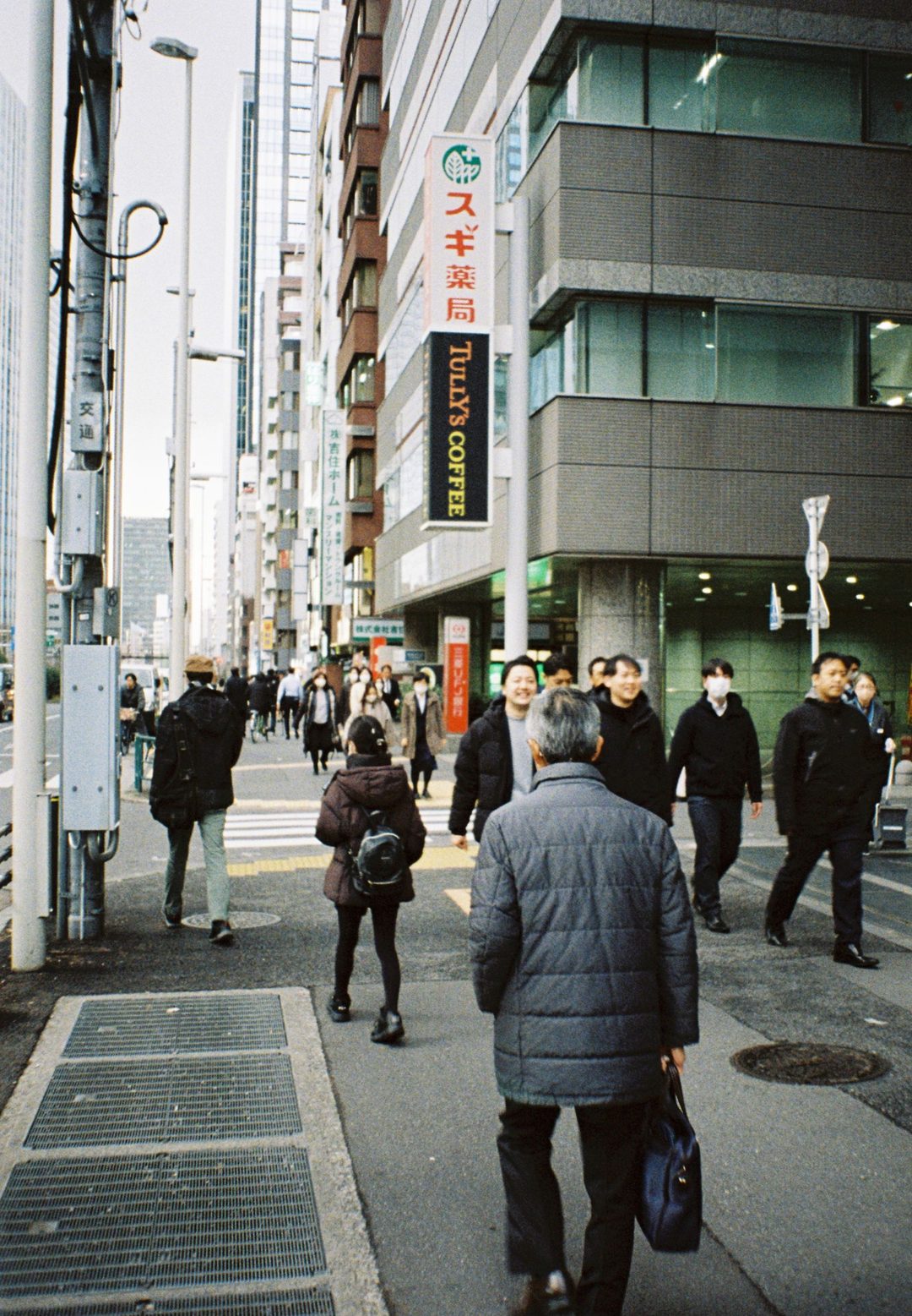 Crowd moving along a shopping street
