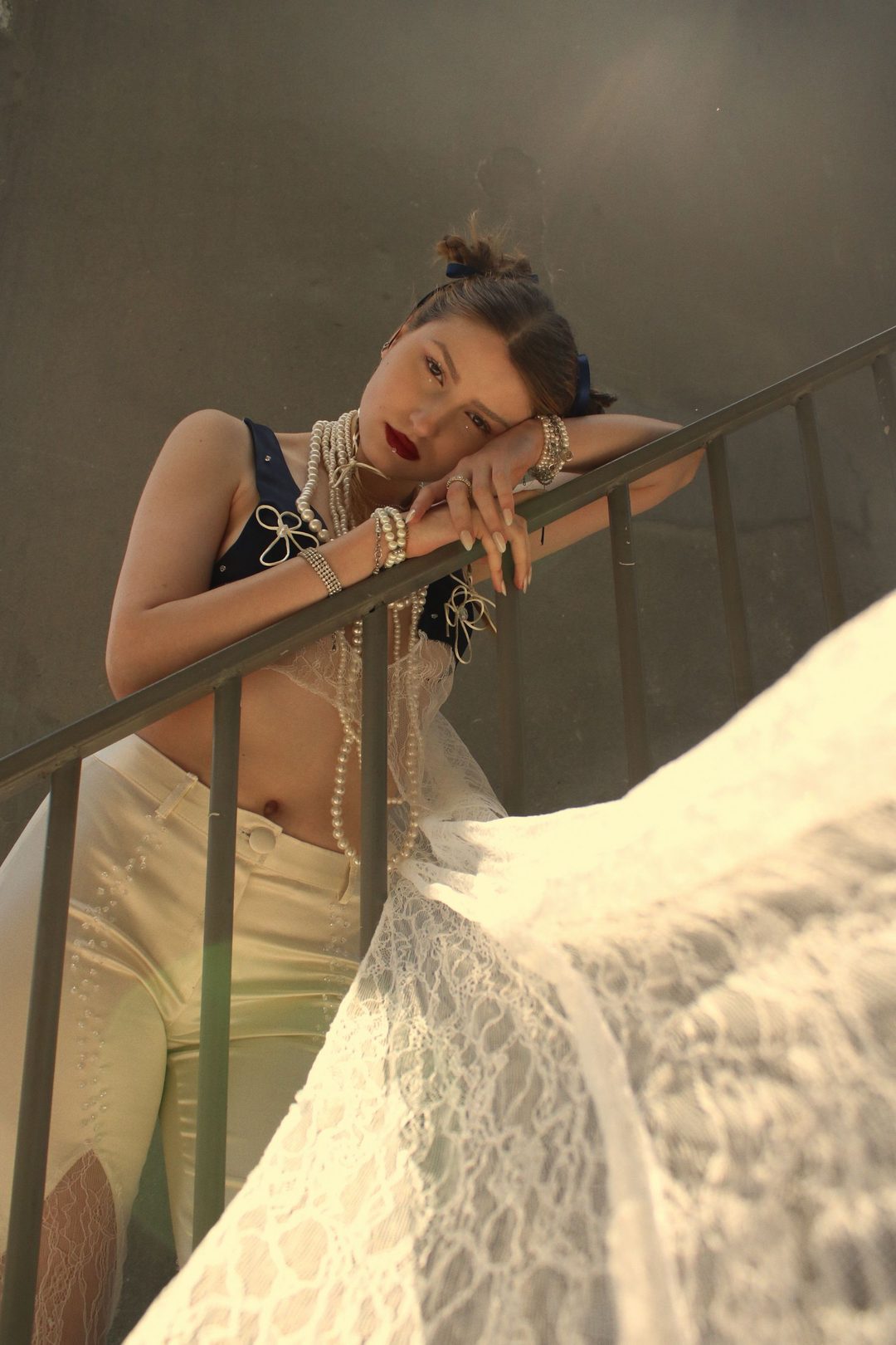 Fur collar and jewellery on a night balcony