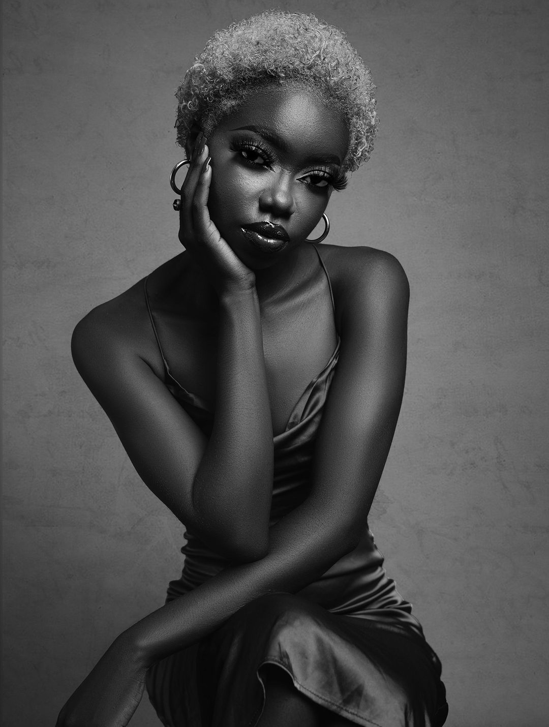 Studio portrait, bare shoulder, direct gaze