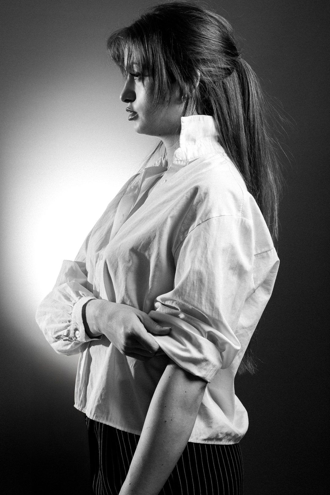 Profile in white blouse, blown highlights