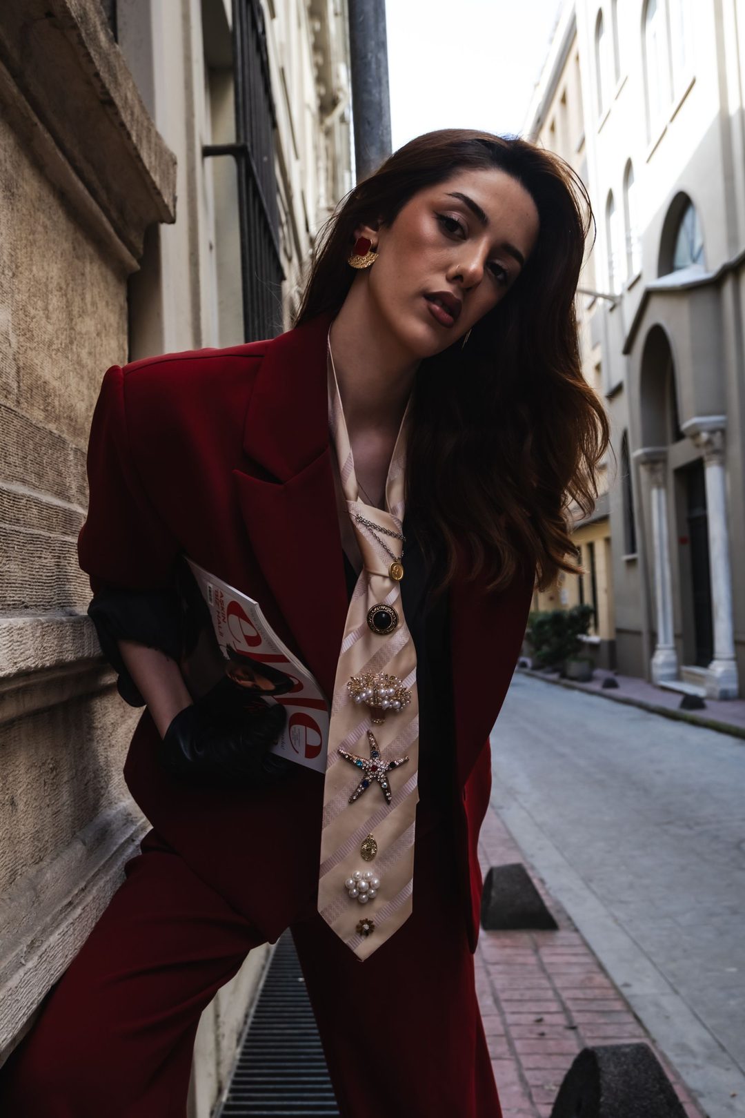 Model looking over her shoulder in a narrow old-town street