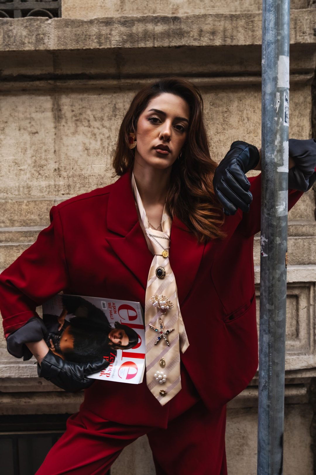 Close crop — blazer, tie and gloved hand